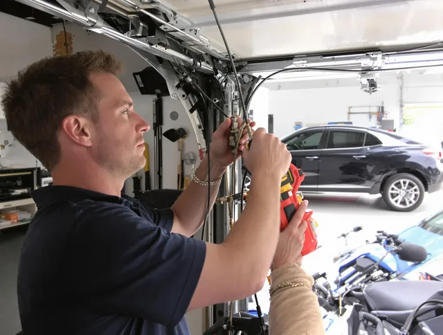 Scituate Garage Door Repair safety certified technician performing cable replacement in Scituate