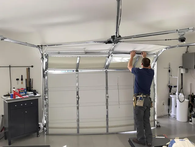 Scituate Garage Door Repair specialist performing precise section replacement on Scituate garage door